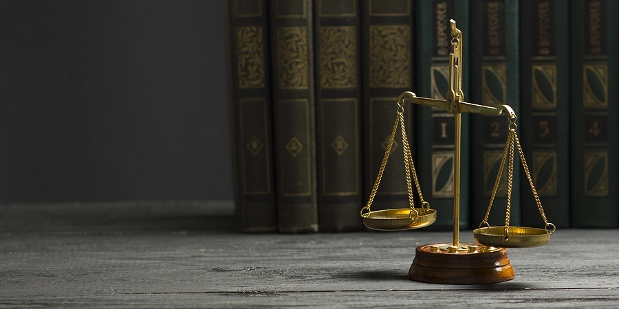 Snapshot of law books, representing the process of determining fault in stop sign accident cases.