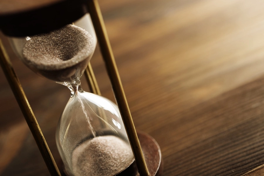 Hourglass symbolizing legal deadlines, illustrating how long someone has to file a medical malpractice claim in Missouri.